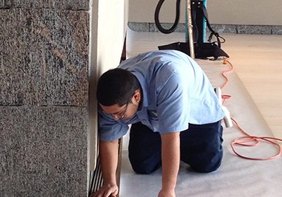technician cleaning commercial floor