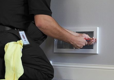 servicemaster technician cleaning air duct