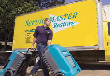 servicemaster technician with 2 dehumidifiers