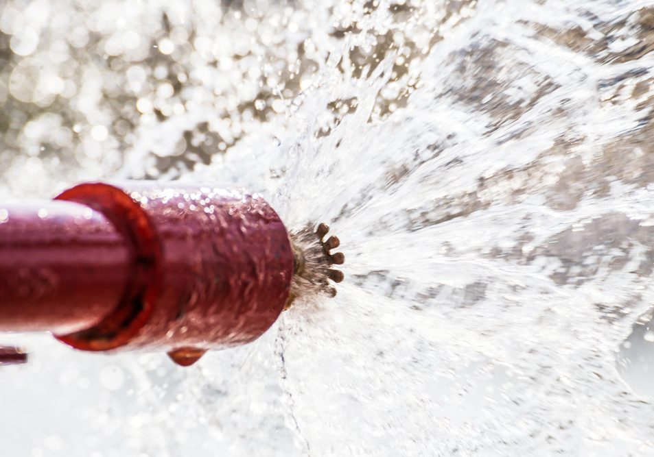 Water spraying from sprinker system valve